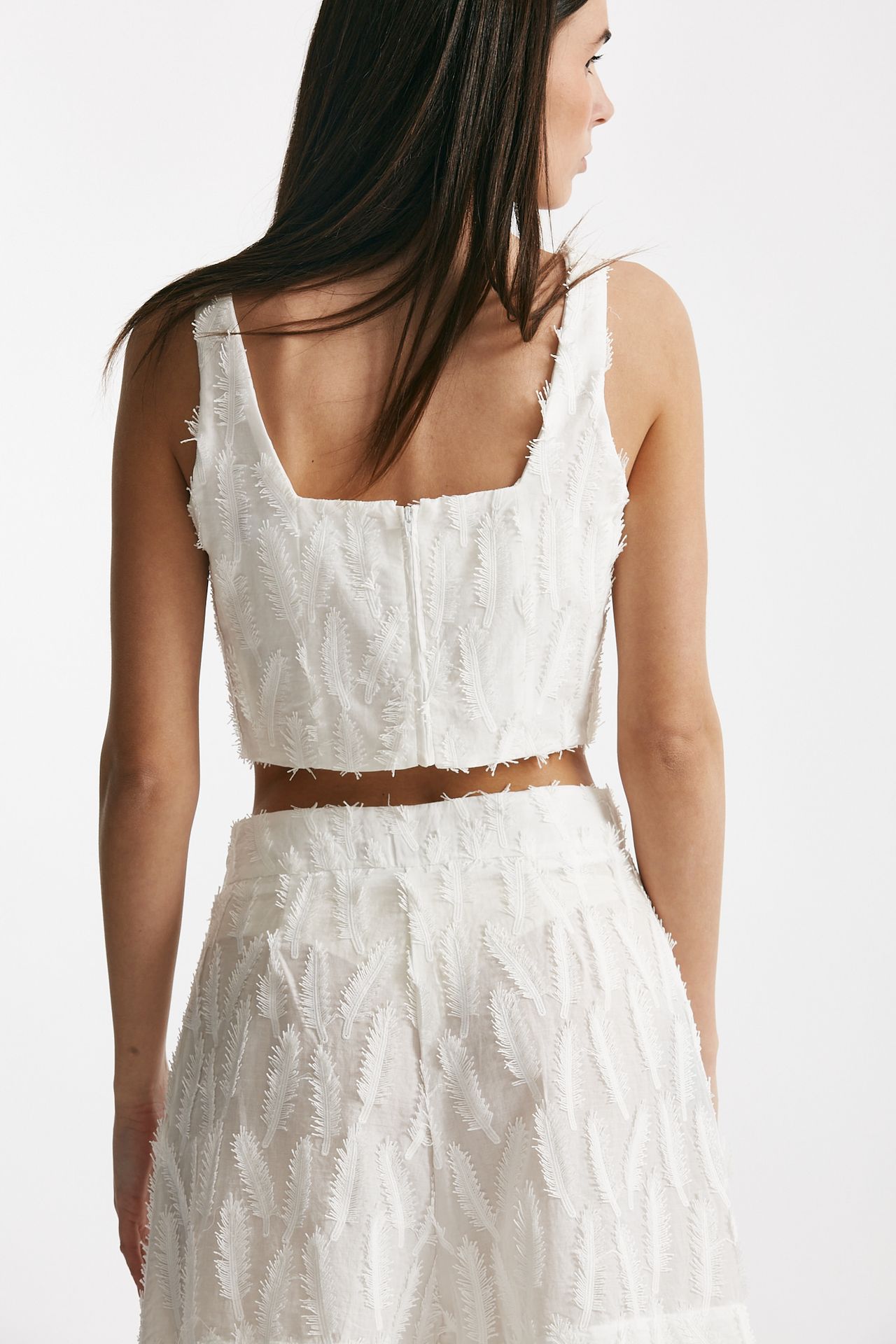 Top crop con applicazioni bianco