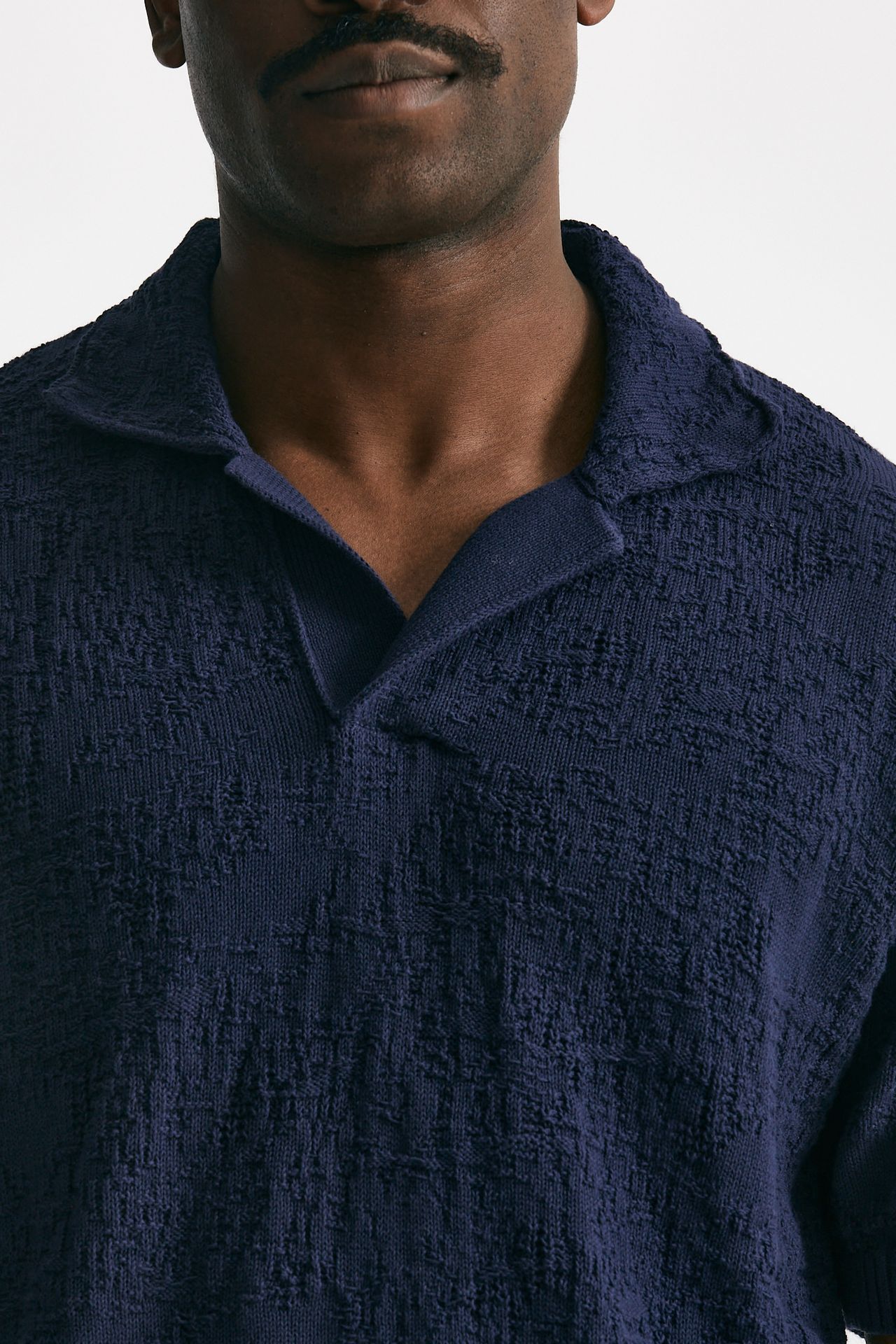 Polo lavorata in cotone blu