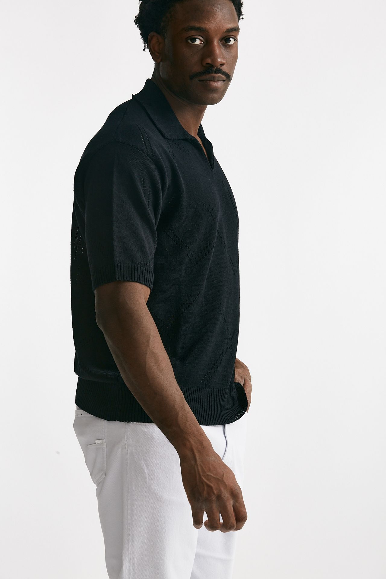 Polo in cotone traforata nero